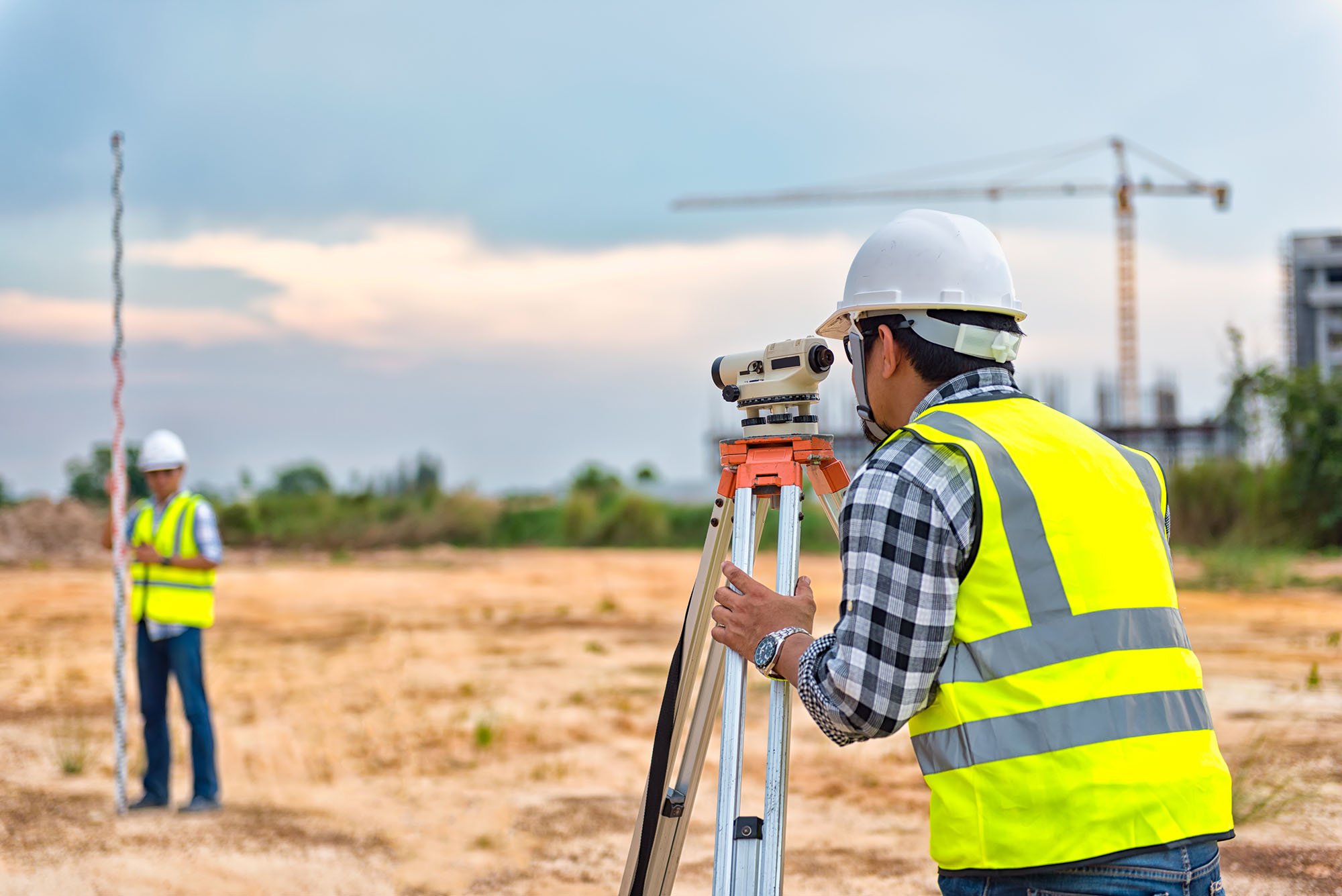 Workers surveying a job site