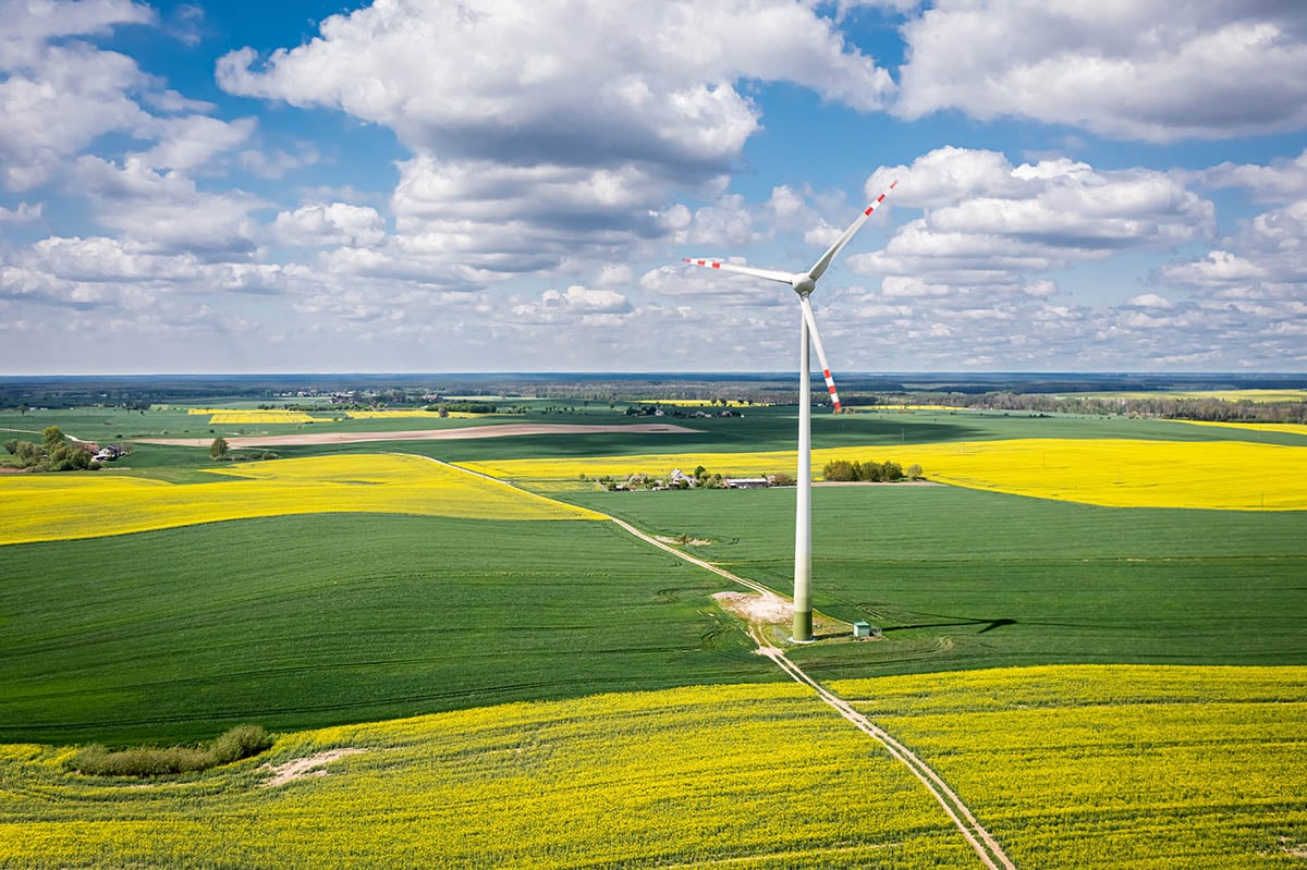 Renewable energy large windmill in farm field